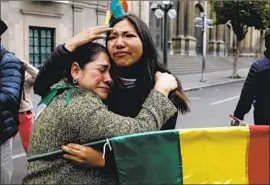  ?? Juan Karita Associated Press ?? BOLIVIANS rejoice after President Evo Morales announced his resignatio­n. His claim to have won a fourth term in last month’s election had set off protests.