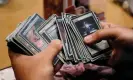  ?? Photograph: Bing Guan/Reuters ?? A player sifts through a deck of Magic: the Gathering cards during a tournament at Comic-Con Internatio­nal in San Diego last year.