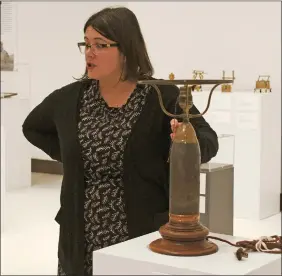  ?? SOUTHWEST BOOSTER PHOTO ?? Julia Krueger led a tour of the Keepsakes of Conflict at the Art Gallery of Swift Current on November 23. The collection is on display until the end of 2018.