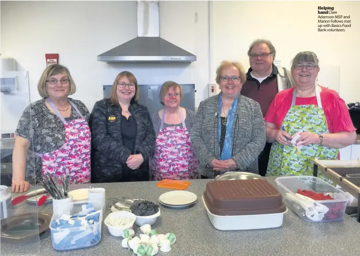  ??  ?? Helping hand Clare Adamson MSP and Marion Fellows met up with Basics Food Bank volunteers