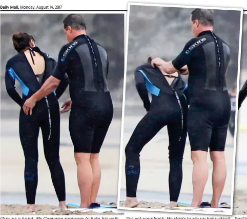  ??  ?? Give us a hand: Mr Cameron prepares to help his wife I’ve got your back: He starts to zip up her wetsuit Surf’s up: He makes a final adjustment before she dives in