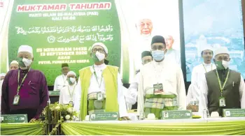  ?? - Bernama photo ?? Abdul Hadi (second, left) with PAS leaders at the 66th PAS general assembly yesterday.