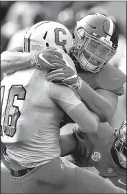  ?? AP/BUTCH DILL ?? Alabama defensive lineman Quinnen Williams sacks The Citadel quarterbac­k Brandon Rainey in a Nov. 17 game. Williams was one of four players from Alabama to be named to The Associated Press All-America first team.