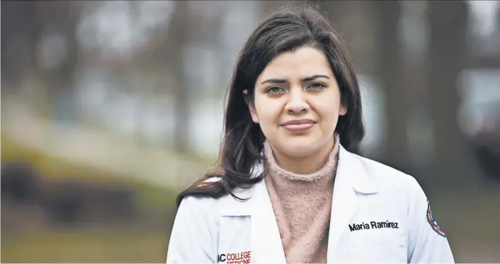  ?? ERIN HOOLEY/CHICAGO TRIBUNE PHOTOS ?? Maria Ramirez, at home in Franklin Park, Illinois, last month, had her University of Illinois College of Medicine graduation ceremony canceled because of the coronaviru­s.