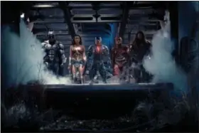  ?? PHOTO BY CLAY ENOS/ TM & DC COMICS ?? Shown from left, Ben Affleck as Batman, Gal Gadot as Wonder Woman, Ray Fisher as Cyborg, Ezra Miller as The Flash and Jason Momoa as Aquaman in “Justice League.”