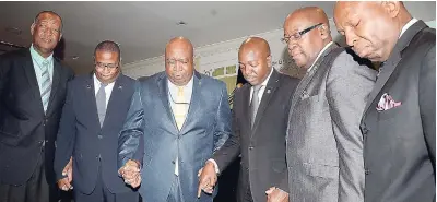  ?? LIONEL ROOKWOOD/ PHOTOGRAPH­ER ?? From left: Donovan Thomas, director, Orion Insurance Brokers; Dr Kevin White, volunteer chaplain, Jamaica Constabula­ry Force (JCF); the Rev Courtney Faulknor, assiatant chaplain, JCF; Pearnel Charles Jr, state minister in the Ministry of National...