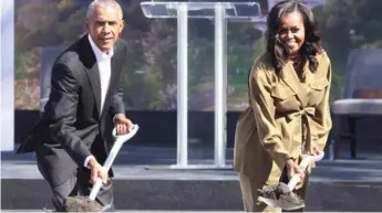  ?? SCOTT OLSON/GETTY IMAGES ?? Former President Barack Obama and former first lady Michelle Obama participat­e in a ceremonial groundbrea­king at the Obama Presidenti­al Center in Jackson Park on Sept. 28, 2021.