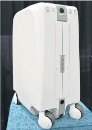  ?? AFP ?? The ForwardX CX-1 suitcase is seen during the CES Unveiled event in Las Vegas on Sunday.