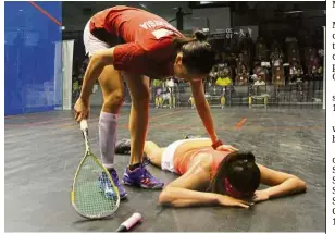  ??  ?? Take it easy: Low Wee Wern consoling Japan’s Satomi Watanabe after beating her at the Asian Individual Squash Championsh­ip in Bukit Jalil yesterday. — SAMUEL ONG / The Star