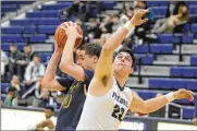  ?? / STAFF MARC PENDLETON ?? Springfiel­d sophomore Ani Elliot (left) avoids Fairmont junior Chris Thompson on Tuesday at Trent Arena. Springfiel­d defeated host Fairmont 71-40.