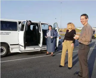  ?? Kim Christense­n / Contributo­r file photo ?? Mark McCrummen, a driver with the Metropolit­an Transit Authority’s vanpool program, waits as riders in Pearland leave his van. A vanpool pilot program in Pearland will run until Jan. 1.