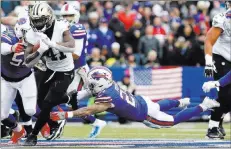  ?? Timothy T. Ludwig ?? Buffalo Bills free safety Jordan Poyer tries in vaintomake­a diving tackle on Saints running back Alvin Kamara (41) in the second halfofnew Orleans’ 47-10 win Sunday in Orchard Park, N.Y.
USA Today