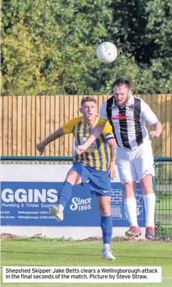  ??  ?? Shepshed Skipper Jake Betts clears a Wellingbor­ough attack in the final seconds of the match. Picture by Steve Straw.