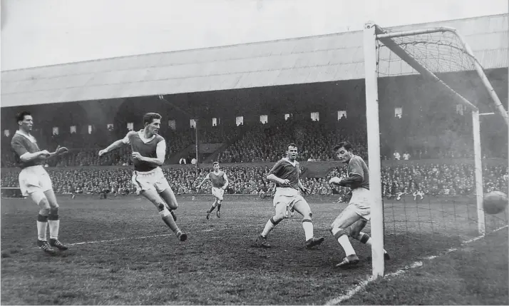  ??  ?? Terry Bly (second left) heads home one of his 81 Posh goals