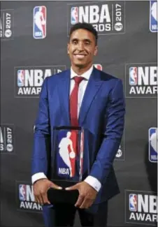  ?? EVAN AGOSTINI — FOR THE ASSOCIATED PRESS ?? Kia NBA Rookie of the Year winner Malcom Brogdon poses in the press room at the 2017 NBA Awards at Basketball City at Pier 36 Monday in New York. Brogdon won selection over two other finalists, the Sixers’ Joel Embiid and Dario Saric.
