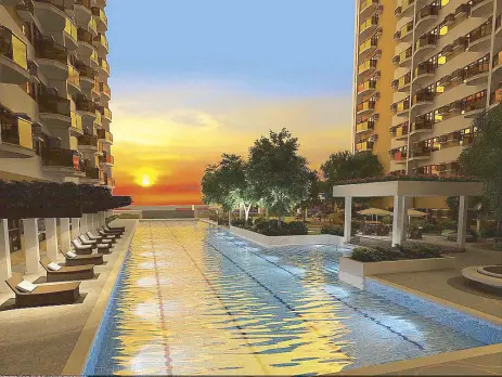  ??  ?? Sunset view: The 50-meter lap pool of Robinsons Land Corporatio­n’s The Radiance Manila Bay