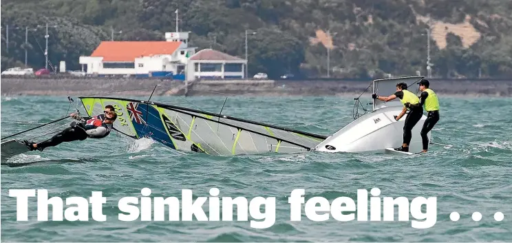  ?? PHOTOSPORT ?? Peter Burling and Blair Tuke survived a near-capsize in race one yesterday to win their fifth – and most treasured – 49er world championsh­ip title off Auckland yesterday.