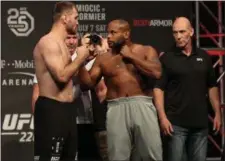  ?? TIM PHILLIS — THE NEWS-HERALD ?? Stipe Miocic and Daniel Cormier pose during a UFC weigh-in event July 6 in Las Vegas.