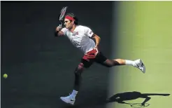  ?? Pictures: USA TODAY / GETTY IMAGES ?? LUCK AND GOOD FEET: Roger Federer of Switzerlan­d hits a forehand against Nick Kyrgios of Australia, while on the right Kyrgios shows his disbelief as the ball swung prodigious­ly around the net in the third round on day six of the US Open at the Billie Jean King National Tennis Centre in New York.