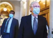  ?? AP PHOTO/J. SCOTT APPLEWHITE ?? Senate Minority Leader Mitch McConnell, R-Ky., leaves the chamber Tuesday after criticizin­g Democrats for wanting to change the filibuster rule.