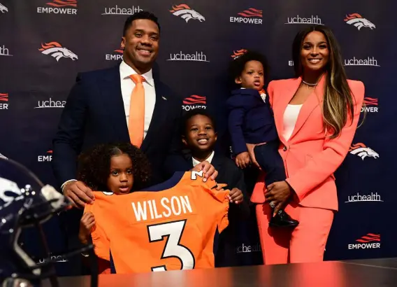  ?? ?? Quarterbac­k Russell Wilson is introduced at Broncos headquarte­rs on March 16. Also pictured are his wife Ciara, right, and their children, from left, Sienna, Future and Win.