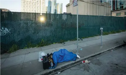  ??  ?? A homeless person in San Francisco. A campaign to block a new homeless shelter has prompted an angry response from the city’s mayor. Photograph: David Levene/The Guardian