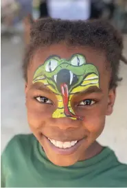  ??  ?? Ethan Wardell smiles after having his face painted with a snake during a fundraiser for The CALL of Union County held Saturday at the CALL Support Center. (Contribute­d)