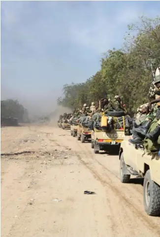  ??  ?? Soldiers from Chad patrol the Nigerian border town of Gamboru after taking control of the city in early Febru