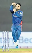  ?? — AFP file photo ?? Afghanista­n’s Rashid Khan bowls during the ICC men’s Twenty20 World Cup cricket match between Afghanista­n and Scotland at the Sharjah Cricket Stadium in Sharjah.