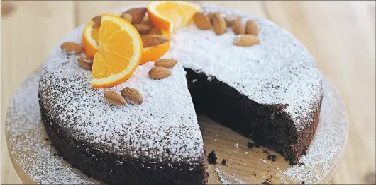  ?? AP PHOTO/MATTHEW MEAD ?? Black cardamom orange flourless chocolate cake.