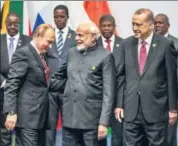  ?? REUTERS ?? Russian President Vladimir Putin, Prime Minister Narendra Modi and Turkish President Tayyip Erdogan ahead of a group picture at the BRICS summit in Johannesbu­rg on Friday