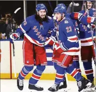  ?? Bruce Bennett / Getty Images ?? The Rangers’ Adam Fox (23) celebrates his first period goal against the Penguins with Mika Zibanejad (93) during Game 1 on Tuesday.