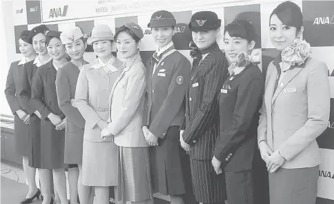  ??  ?? To commemorat­e the 30th anniversar­y of the launch of ANA’s internatio­nal flights, cabin attendants at Narita Airport wear the airline’s uniforms from that period in chronologi­cal order of their issuance. — WP-Bloomberg photo