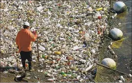  ?? Ken Hively Los Angeles Times ?? INDUSTRY opposition helped kill legislatio­n that would have phased out 75% of single-use plastic containers by 2030. Above, debris in Ballona Creek in 2001.