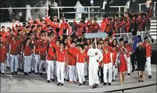  ?? XINHUA ?? Athletes and coaches of the Chinese delegation enter the stadium during Thursday’s opening ceremony of the Special Olympics World Games at Zayed Sports City in Abu Dhabi.