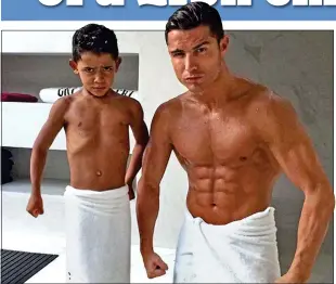  ??  ?? STRONG RESEMBLANC­E: Ronaldo showing off his physique in a fun snap with son Cristiano Jr.