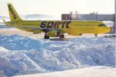  ?? AFP ?? A Spirit Airlines aeroplane at Logan Internatio­nal. Hundreds of flights were cancelled and delayed because of the storm.