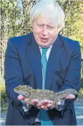  ??  ?? Mr Johnson and lizard yesterday