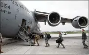  ?? PATRICK O’REILLY / U.S. AIR FORCE ?? Staff from the 445th Airlift Wing’s Aerospace Medicine and Aeromedica­l Staging Squadrons board a C-17 earlier this year. C-17s were flying into Afghanista­n and other parts of the Middle East in a matter of weeks after the 9/11 attacks.