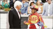  ?? Gregory Payan / Associated Press ?? The Kentucky Derby leads off the first Triple Crown season in decades without the chance of Bob Baffert, left, officially winning one or more of the three races.