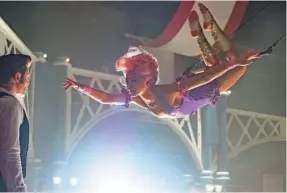  ?? NIKO TAVERNISE ?? Phillip Carlyle (Zac Efron) is entranced by trapeze artist Anne Wheeler (Zendaya) in “The Greatest Showman.”