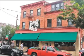  ?? Hearst Connecticu­t Media file photo ?? Scenes from Wooster Street in New Haven, including the iconic Frank Pepe Pizzeria Napoletana.