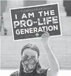  ?? NICHOLAS KAMM, AFP VIA GETTY IMAGES ?? An anti- abortion activist protests in front of the Supreme Court June 29, 2020.