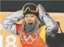  ?? THE ASSOCIATED PRESS ?? Chloe Kim of the United States reacts to her score Tuesday during the women’s halfpipe finals at Phoenix Snow Park at the 2018 Winter Olympics in Pyeongchan­g, South Korea.