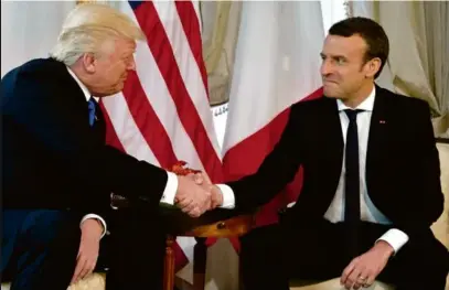  ?? EVAN VUCCI. AP PETER DEJONG. AP ?? A gauche, au Vatican, mercredi. Ci-dessous, avec Emmanuel Macron, jeudi, à Bruxelles.