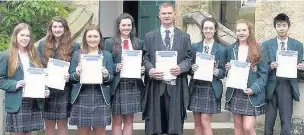  ??  ?? Success Senior pupils were presented with their UCAPE Diplomas at Wellington School by headteache­r Simon Johnson