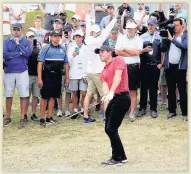  ??  ?? ALL EYES ON HIM Mcilroy chipping on to the 13th green