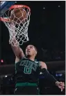  ?? AP/MARY ALTAFFER ?? Boston forward Jayson Tatum scored 24 points and grabbed 14 rebounds in the Celtics’ 103101 victory over the New York Knicks on Saturday night.