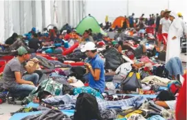  ?? AP PHOTO/MARCO UGARTE ?? Central American migrants settle in a shelter Tuesday at the Jesus Martinez stadium in Mexico City.