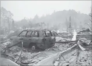  ?? STAFF FILE PHOTO ?? Homes in Santa Rosa are destroyed in a wildfire Oct. 9.